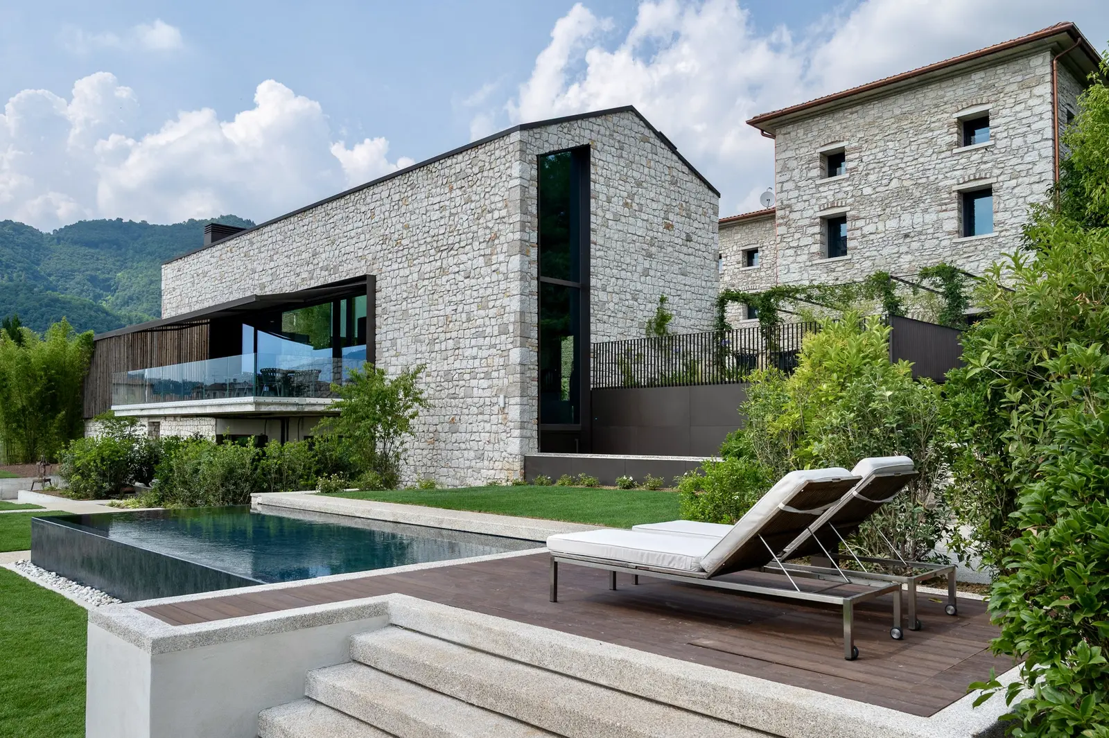The Relais Borgo Taurino pool among the stone buildings