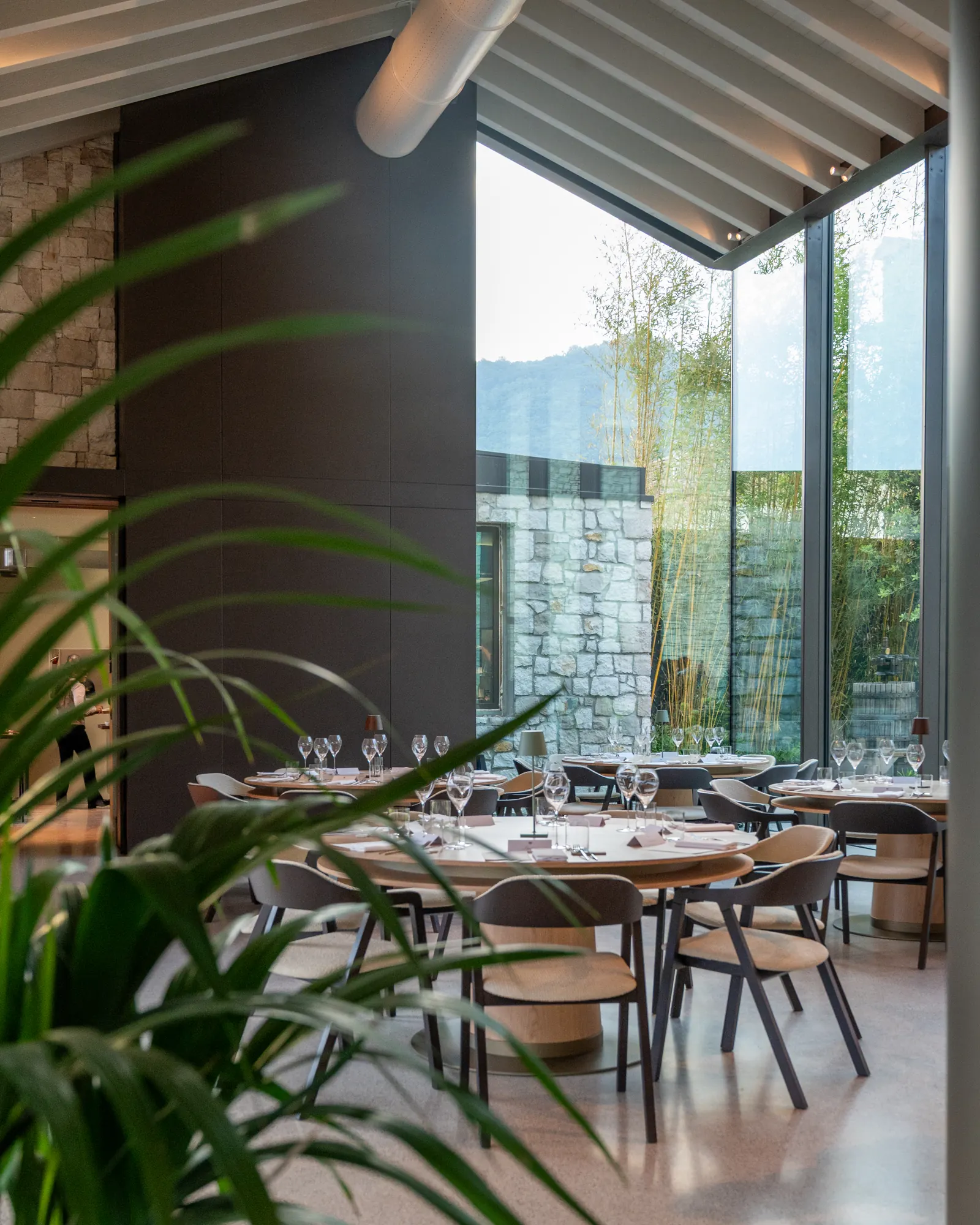 The Ristorante Trame dining room with glass walls onto the courtyard